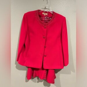 Beautiful red suit with beaded collar and embellished skirt.